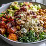Golden roasted sweet potatoes and Brussels sprouts top a Fall Harvest Bowl of wild rice and kale.