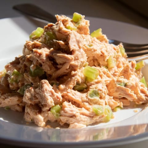 This Spicy Zesty Tuna Salad features flaky tuna tossed in creamy, spicy mayo and fresh lemon juice, served in lettuce wraps for a light, refreshing meal.
