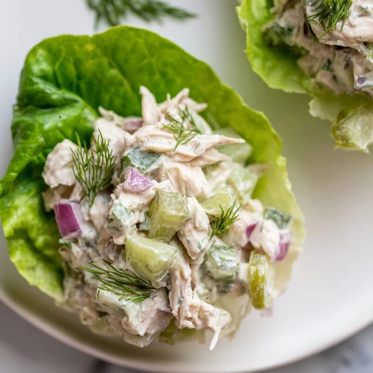 Bright, tangy Dill Pickle Chicken Salad nestled in crisp lettuce cups, perfect for a light, low-carb lunch or dinner.