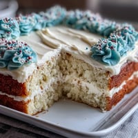 Fluffy vanilla sheet cake with creamy vanilla buttercream, decorated with festive graduation-themed sprinkles. Perfect for celebrating Class of 2026 milestones.